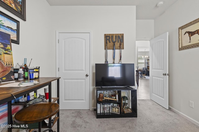 sitting room with carpet floors and baseboards
