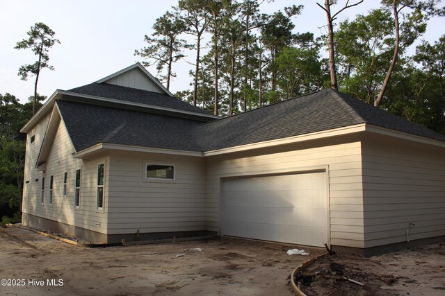 3359 Portside Dr SW, Supply, NC 28462 - view of home's exterior featuring a garage, a shingled roof, and driveway