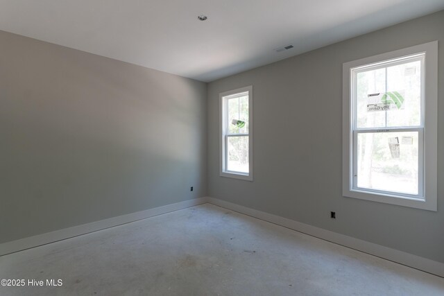 3359 Portside Dr SW, Supply, NC 28462 - spare room with concrete flooring and baseboards