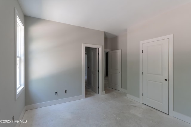 3359 Portside Dr SW, Supply, NC 28462 - unfurnished bedroom featuring unfinished concrete flooring and baseboards