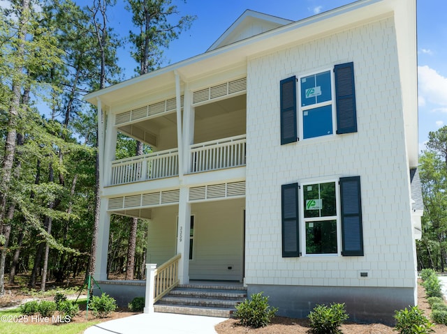 3359 Portside Dr SW, Supply, NC 28462 - view of front of home with a balcony and a porch