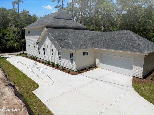 3359 Portside Dr SW, Supply, NC 28462 - view of property exterior featuring driveway, roof with shingles, and an attached garage