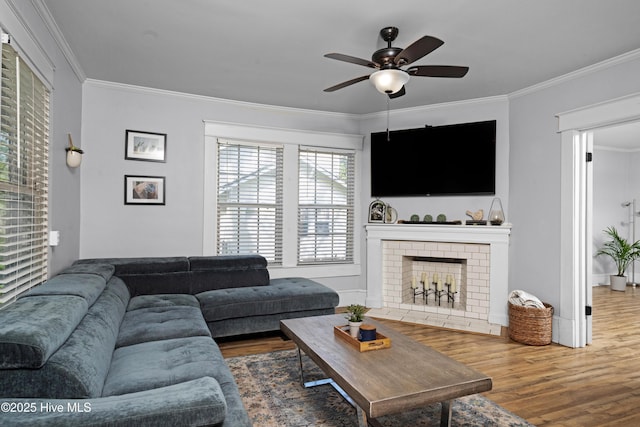 1508 Rhem Ave, New Bern, NC 28560 - living area with a ceiling fan, a fireplace, crown molding, and wood finished floors