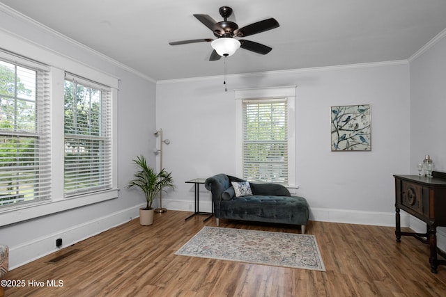 1508 Rhem Ave, New Bern, NC 28560 - living area featuring a healthy amount of sunlight, ornamental molding, visible vents, and wood finished floors