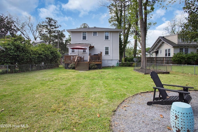 1508 Rhem Ave, New Bern, NC 28560 - back of house featuring a yard, a wooden deck, and a fenced backyard