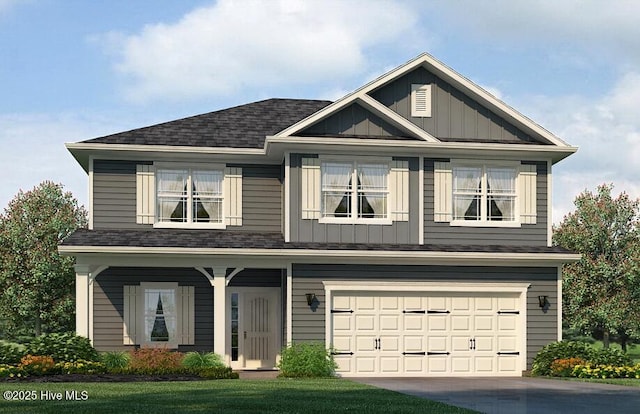 view of front facade featuring board and batten siding, an attached garage, a shingled roof, and driveway