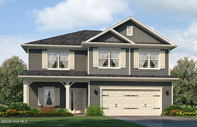 view of front of home with board and batten siding, an attached garage, driveway, and roof with shingles