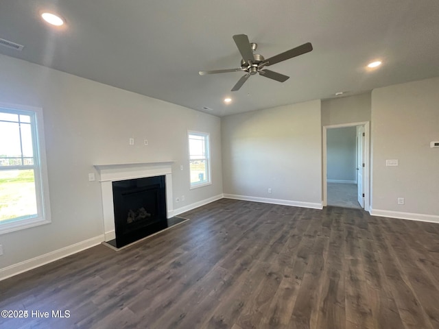 unfurnished living room with recessed lighting, dark wood-style flooring, baseboards, and ceiling fan