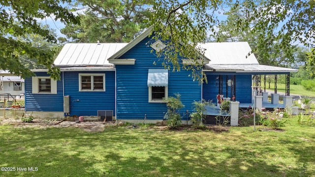 104 W Trent St, Trenton, NC 28585 - back of house featuring a yard, metal roof, central AC unit, and a porch