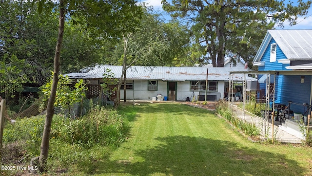 104 W Trent St, Trenton, NC 28585 - rear view of house featuring metal roof