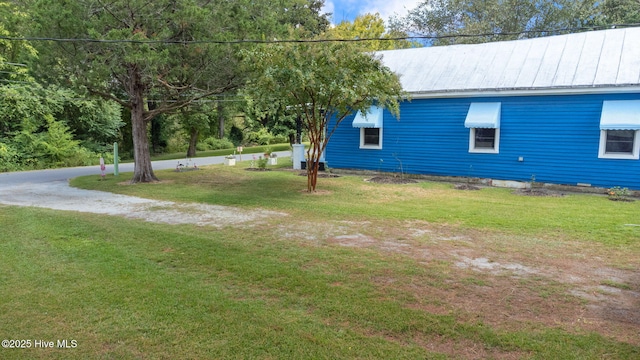 104 W Trent St, Trenton, NC 28585 - view of home's exterior featuring a lawn, metal roof, and a standing seam roof