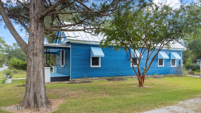 104 W Trent St, Trenton, NC 28585 - view of side of property with a yard and metal roof