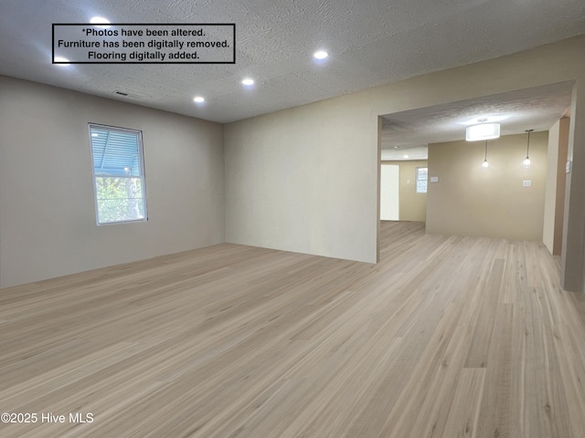 104 W Trent St, Trenton, NC 28585 - unfurnished room with healthy amount of natural light, wood finished floors, a textured ceiling, and recessed lighting