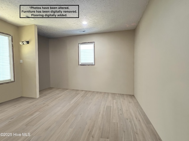 104 W Trent St, Trenton, NC 28585 - spare room featuring a textured ceiling and wood finished floors