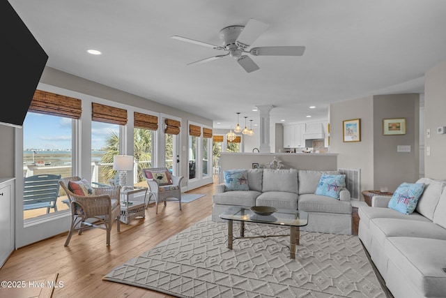 living area featuring light wood-type flooring, visible vents, recessed lighting, and ceiling fan