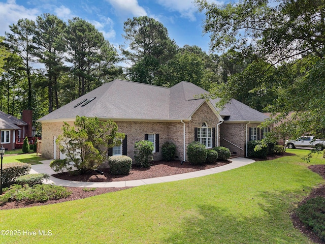 106 Oakmont Cir, New Bern, NC 28562 - view of front of home with brick siding, a front lawn, and roof with shingles