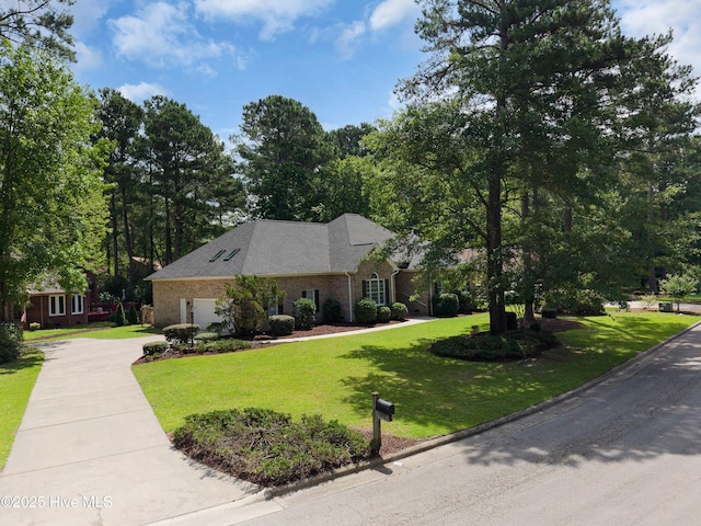 106 Oakmont Cir, New Bern, NC 28562 - view of front of house with a garage, a front lawn, driveway, and brick siding