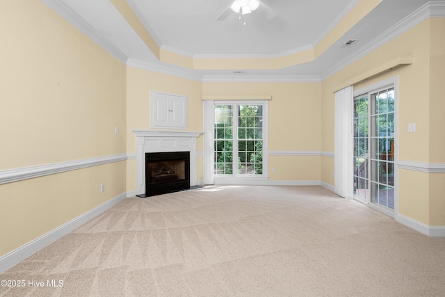 106 Oakmont Cir, New Bern, NC 28562 - unfurnished living room featuring a tray ceiling, a fireplace with flush hearth, plenty of natural light, carpet, and crown molding