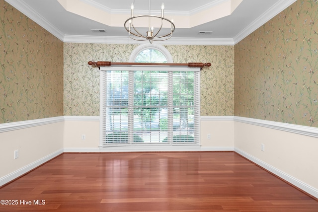 106 Oakmont Cir, New Bern, NC 28562 - unfurnished dining area featuring a chandelier, plenty of natural light, a tray ceiling, wood finished floors, and crown molding