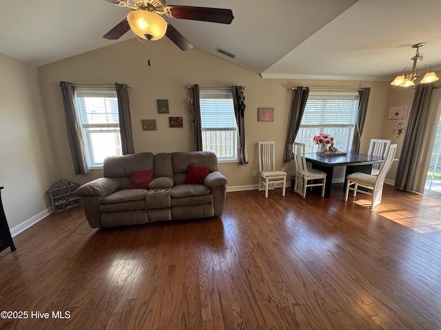 living room featuring visible vents, dark wood finished floors, and a wealth of natural light