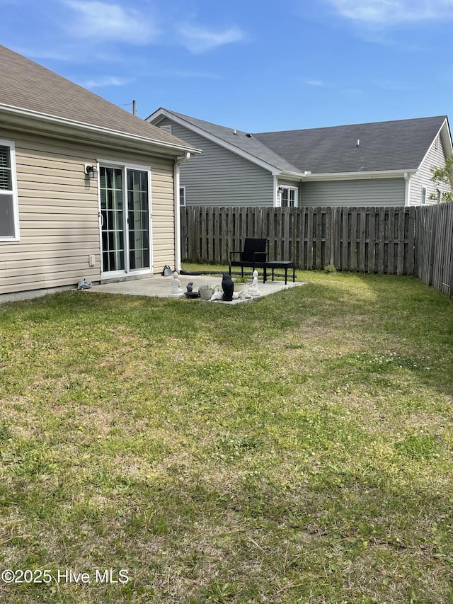 view of yard featuring a patio and a fenced backyard