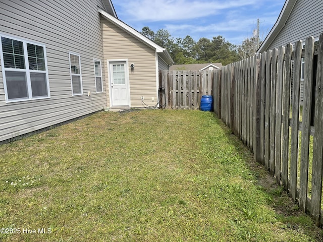 view of yard with a fenced backyard