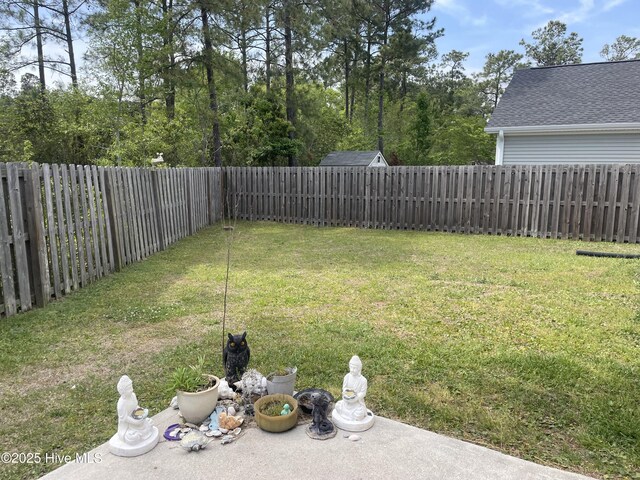 view of yard with a fenced backyard