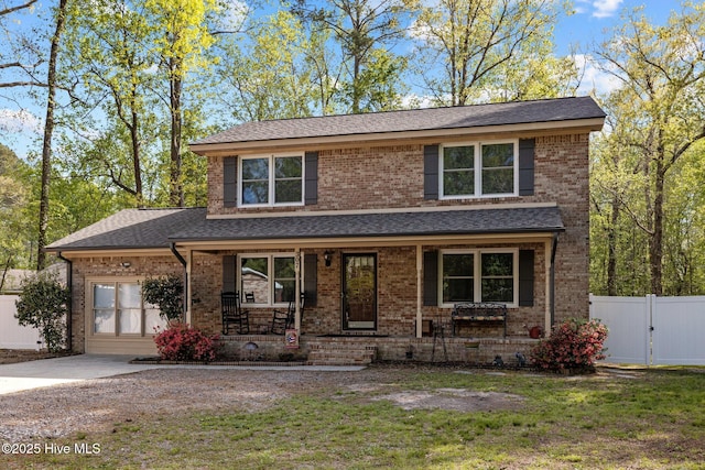 307 Little Rossie Rd, New Bern, NC 28560 - traditional home with a porch, roof with shingles, and brick siding
