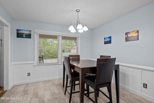 307 Little Rossie Rd, New Bern, NC 28560 - dining room featuring a decorative wall, wainscoting, and a chandelier