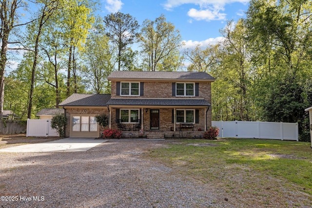 307 Little Rossie Rd, New Bern, NC 28560 - traditional-style house featuring driveway, a gate, fence, a porch, and brick siding