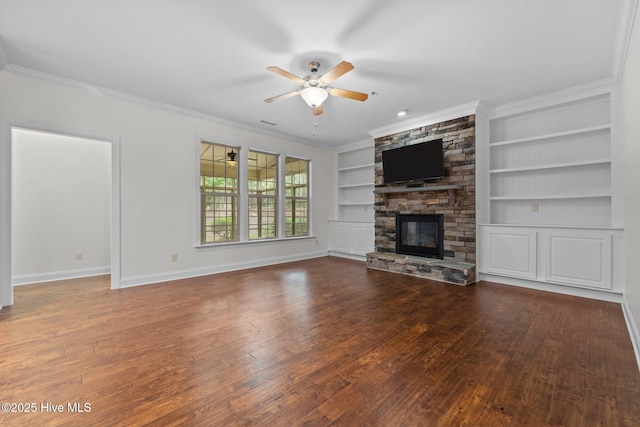 80 Whistling Straight Rd, Pinehurst, NC 28374 - unfurnished living room featuring wood-type flooring, built in features, a ceiling fan, a stone fireplace, and ornamental molding
