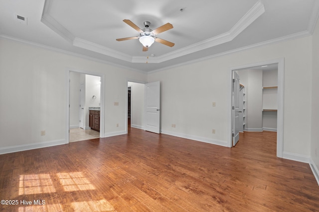 80 Whistling Straight Rd, Pinehurst, NC 28374 - spare room featuring ceiling fan, a tray ceiling, crown molding, and wood finished floors