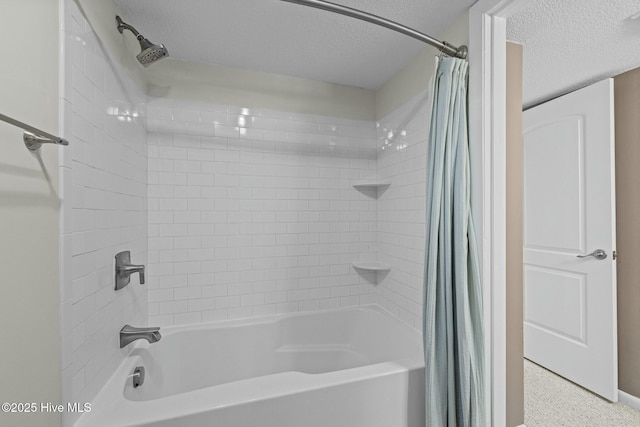 full bathroom with shower / tub combo with curtain and a textured ceiling
