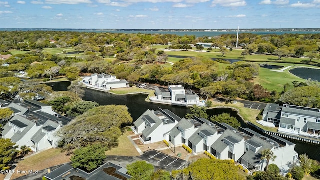 bird's eye view with a water view, a residential view, and view of golf course