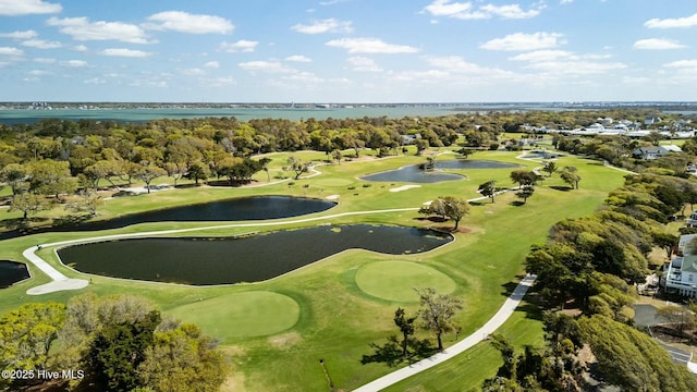 birds eye view of property with a water view and view of golf course
