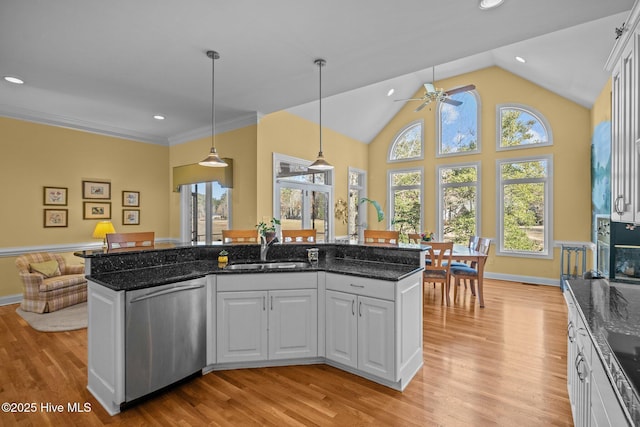 kitchen with light wood-style floors, a sink, a ceiling fan, and dishwasher