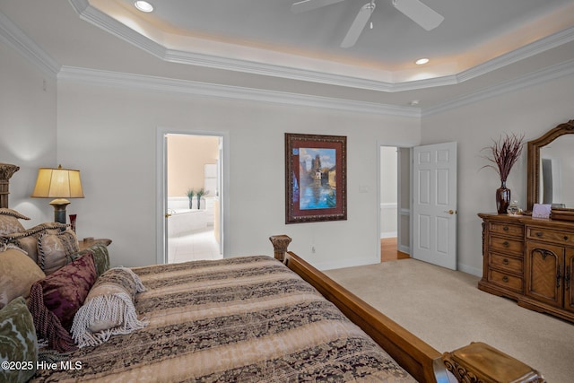 bedroom with crown molding, carpet, a raised ceiling, and baseboards