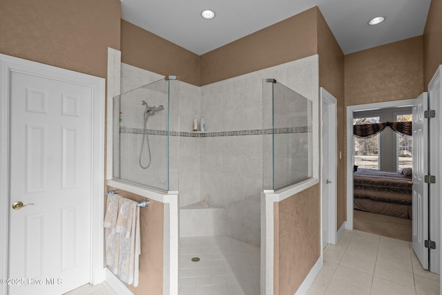 bathroom featuring a walk in shower, baseboards, tile patterned floors, ensuite bathroom, and recessed lighting