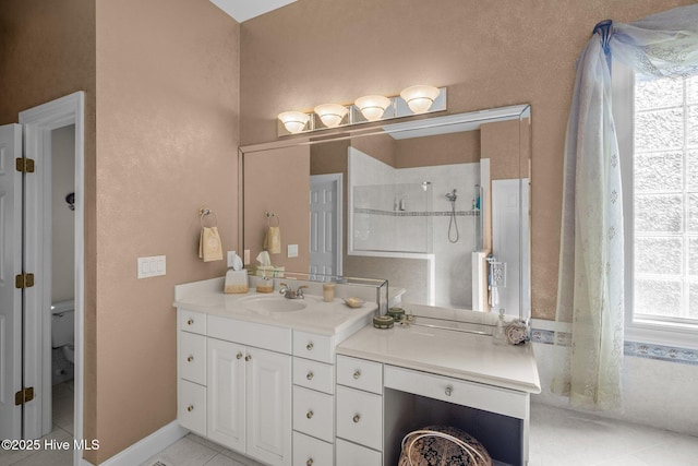 full bathroom featuring a walk in shower, tile patterned flooring, vanity, and toilet