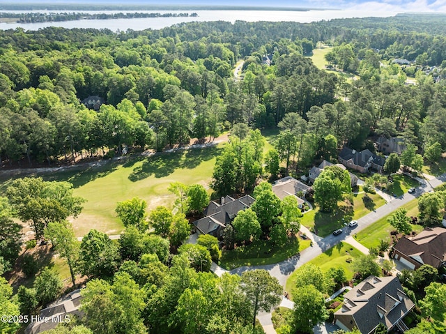aerial view with a residential view, a water view, and a forest view
