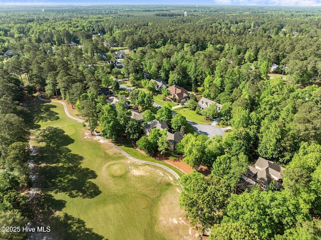 birds eye view of property with a residential view and a wooded view