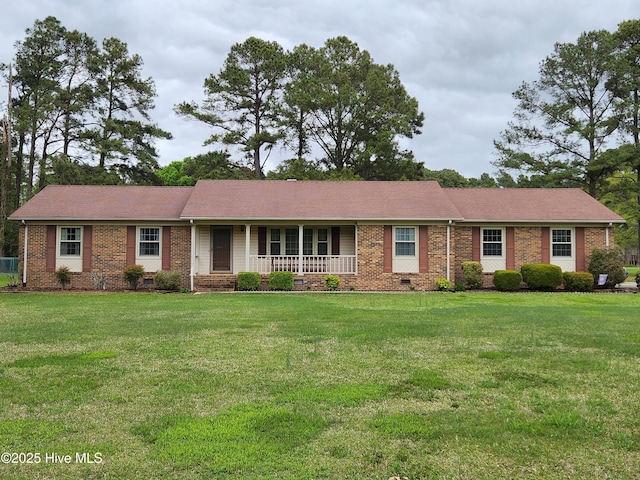 single story home with a front yard, a porch, brick siding, and crawl space