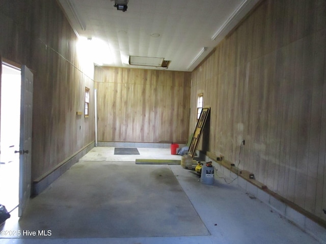 interior space featuring wooden walls