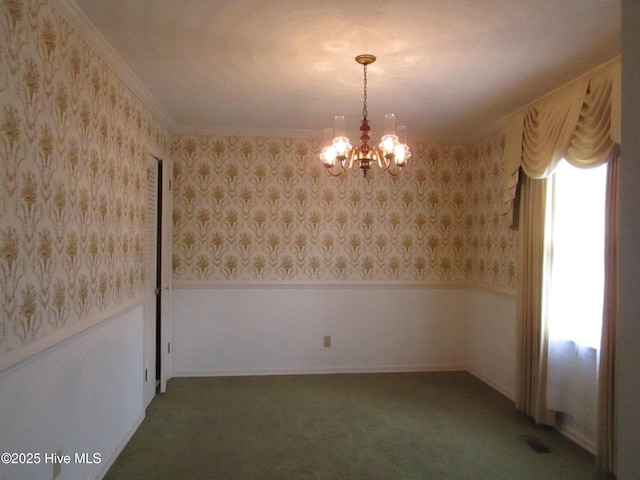 spare room with a chandelier, carpet flooring, wainscoting, and wallpapered walls