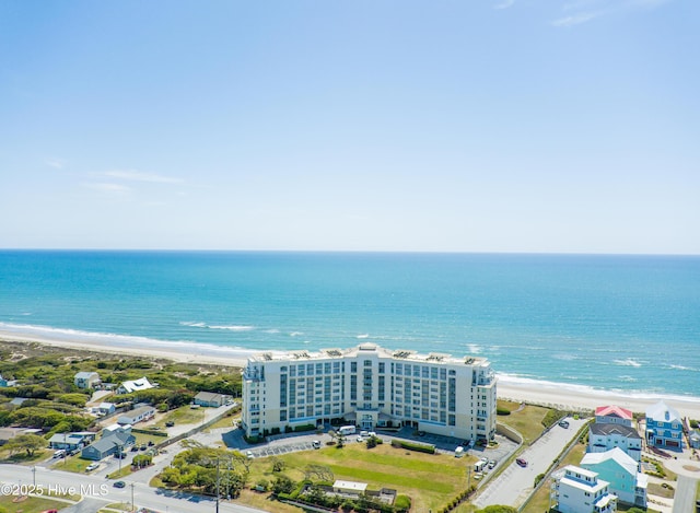 bird's eye view with a water view and a beach view