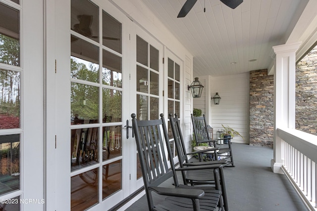 balcony featuring french doors, covered porch, and ceiling fan