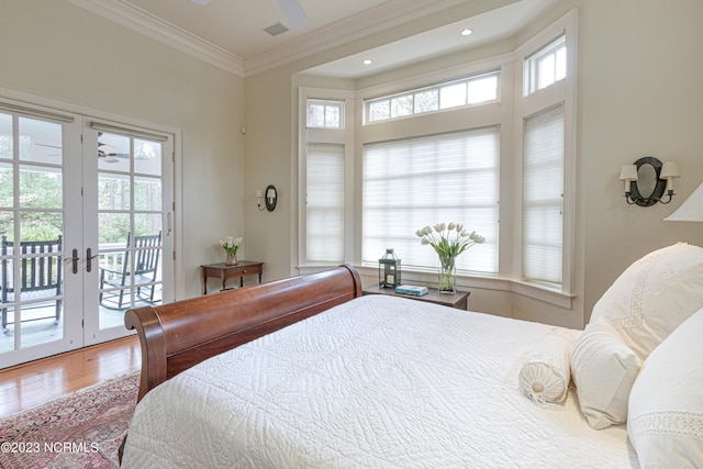 bedroom featuring recessed lighting, french doors, crown molding, access to exterior, and wood finished floors