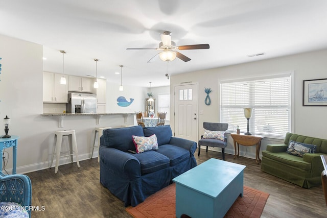 living area with visible vents, recessed lighting, dark wood finished floors, ceiling fan, and baseboards