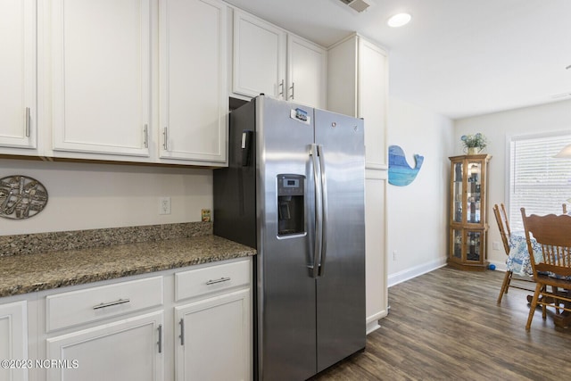 kitchen with stainless steel refrigerator with ice dispenser, white cabinets, baseboards, dark wood-style floors, and recessed lighting
