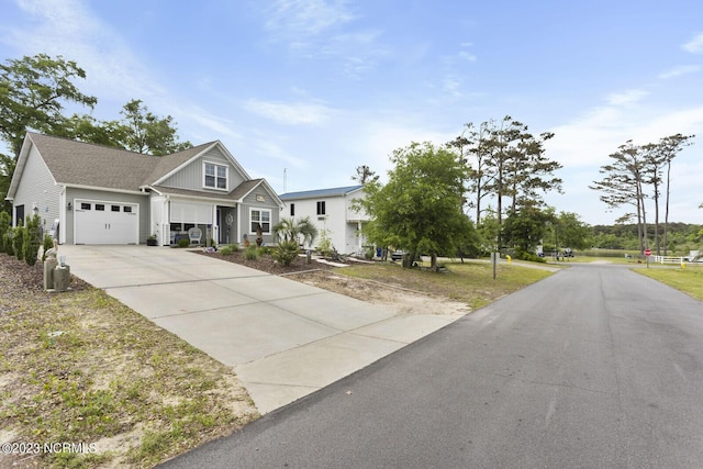 view of front of home with driveway and a garage